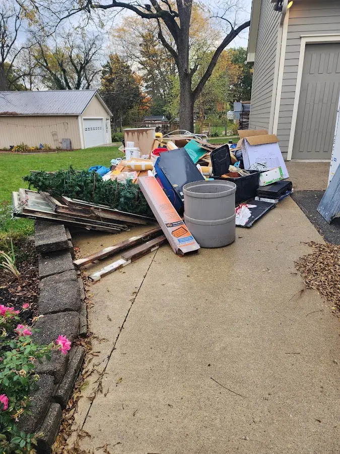 Dumpster being loaded with debris for Commercial Dumpster Rental in Marlton